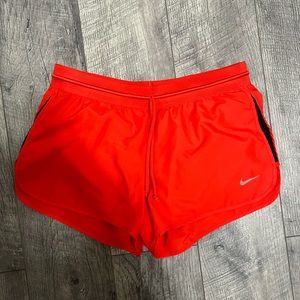 Red Nike running shorts